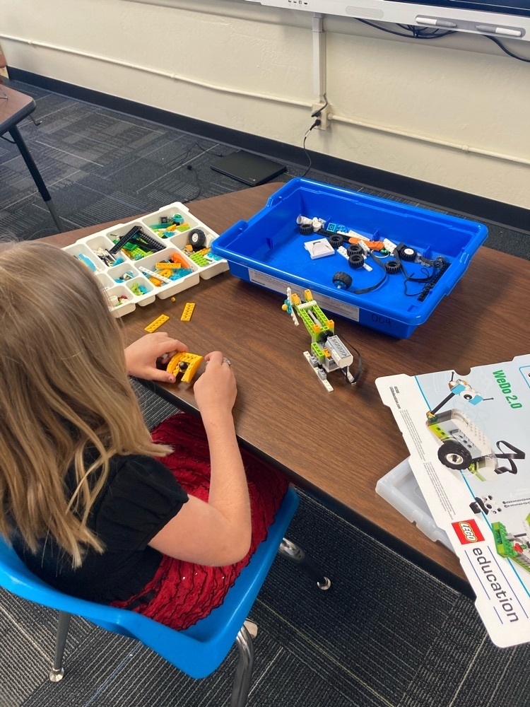 student with lego coding