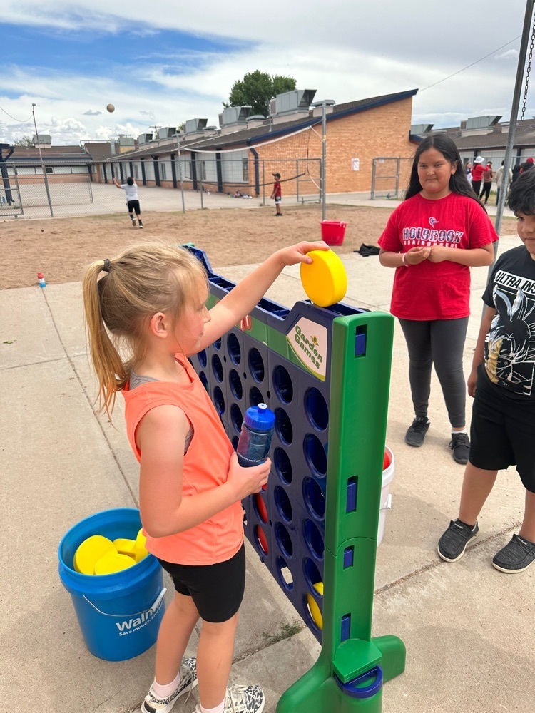 students playing four square 