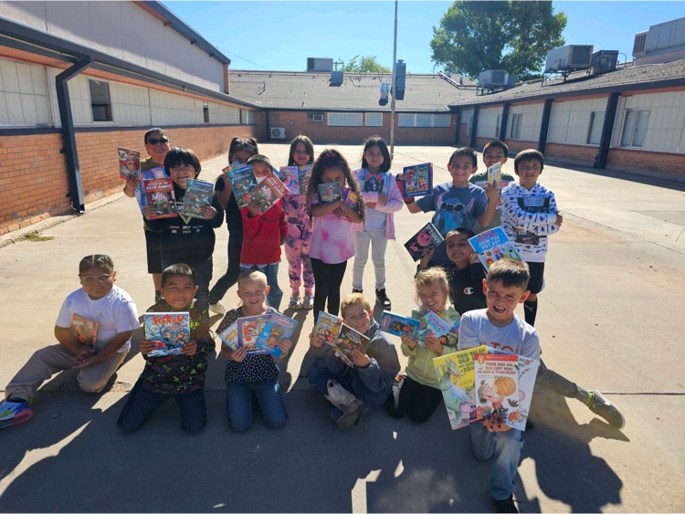 Mrs. Hughey’s class showing their books  